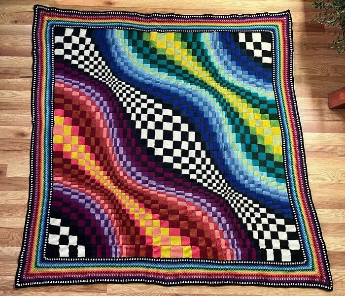 Colorful crochet blanket with wavy checkerboard pattern