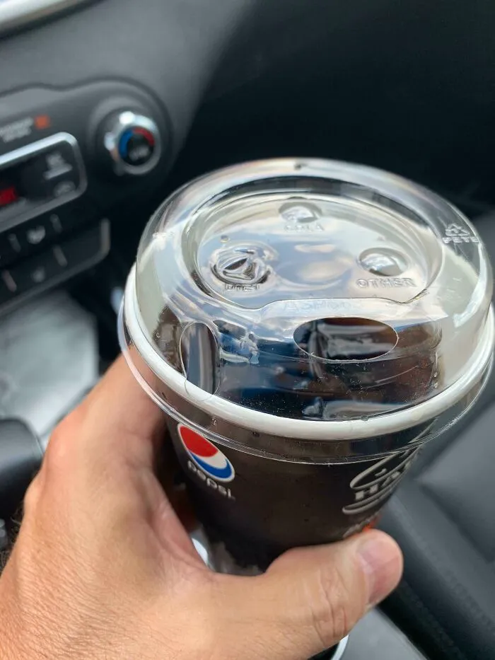 This Harvey’s Sippy Lid - Has A Hole To Drink From And Another One To The Left That Pots Your Drink All Over Your Lap!