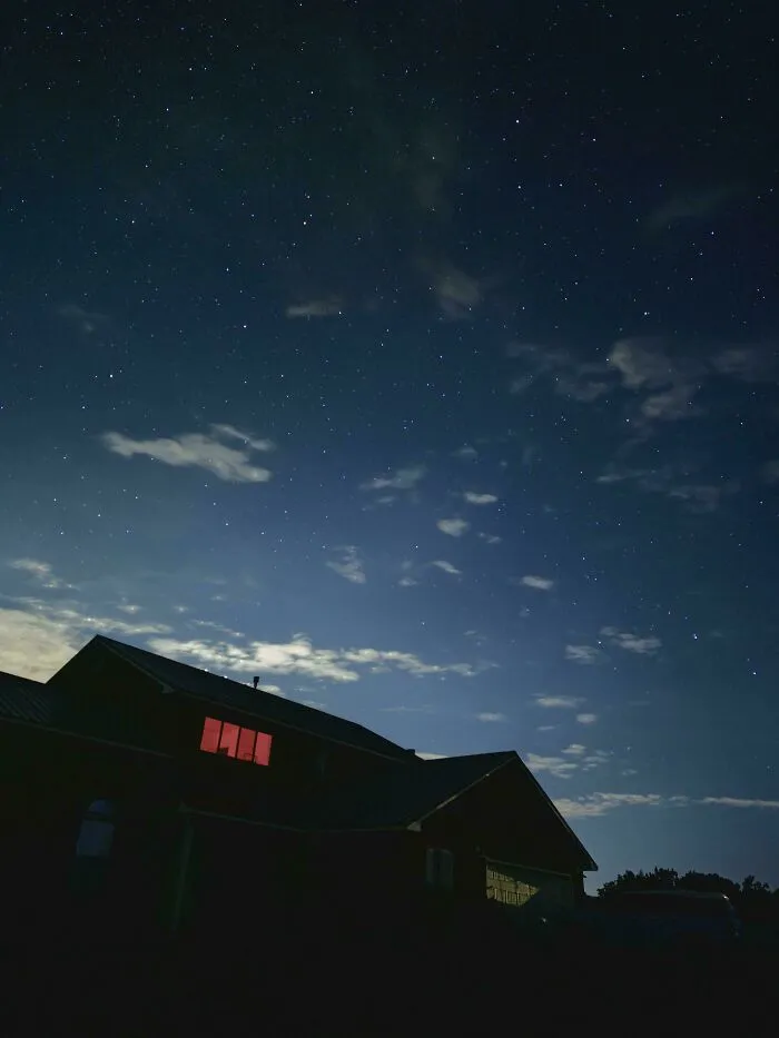 I Was Taking Long Exposure Pictures Of The Night Sky And Thought It'd Be Cute To Get My New House In One Shot. Pic Looks Nice But... That Red Window? There's No Light In That Room
