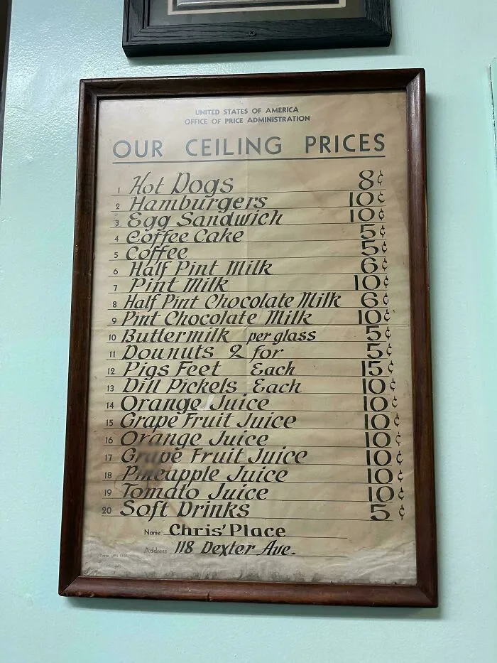 A vintage menu of ceiling prices from American history including hot dogs, hamburgers, and coffee.