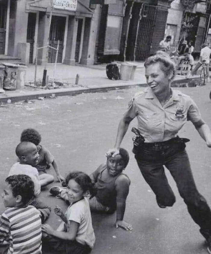 Nypd Policewoman Playing Duck, Duck, Goose, 1970s