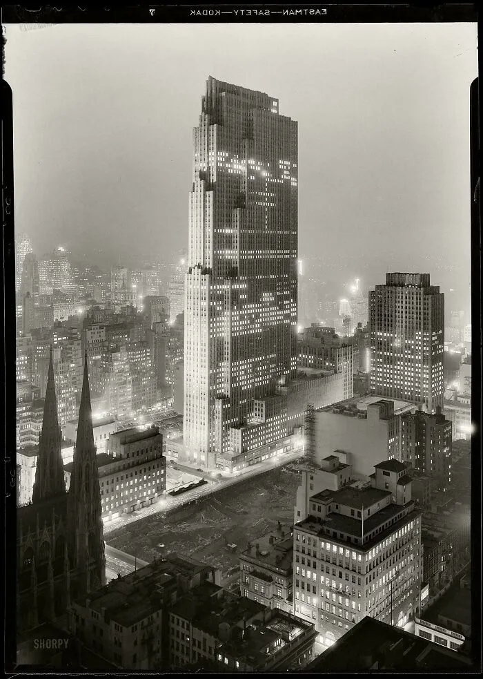 Rare photo of Rockefeller Center and surrounding skyscrapers at night from American history.