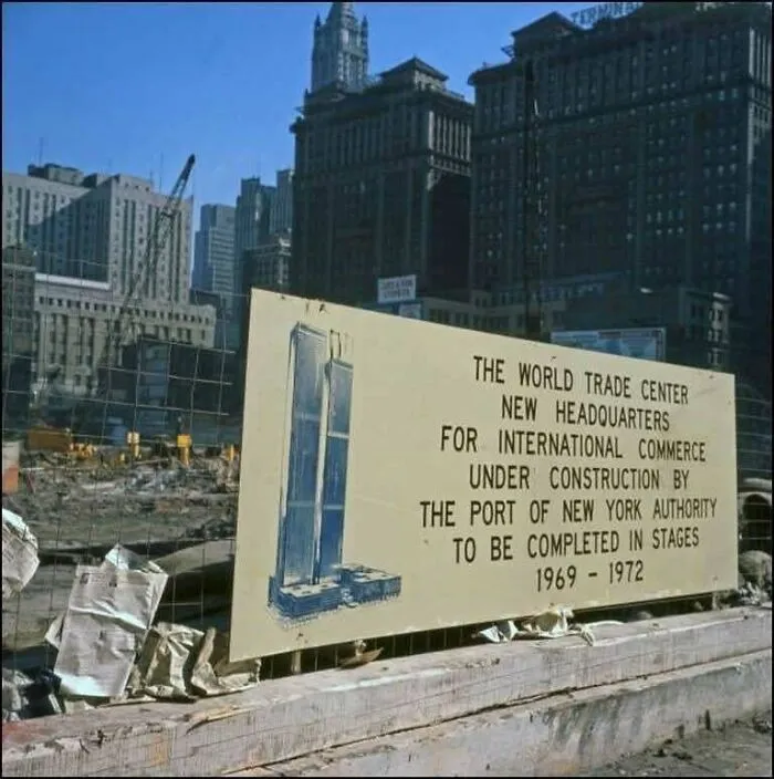 Rare photo of World Trade Center under construction sign, a fascinating moment in American history.