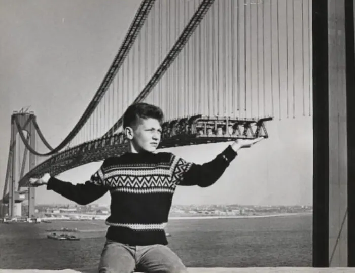 Child Poses In Front Of The Verrazzano-Narrows Bridge During Its Construction, Cir. 1963