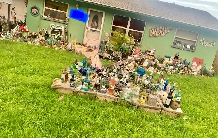 My Neighbor Decorating Their Yard With Bottles Of Alcohol, Yes This Is Florida