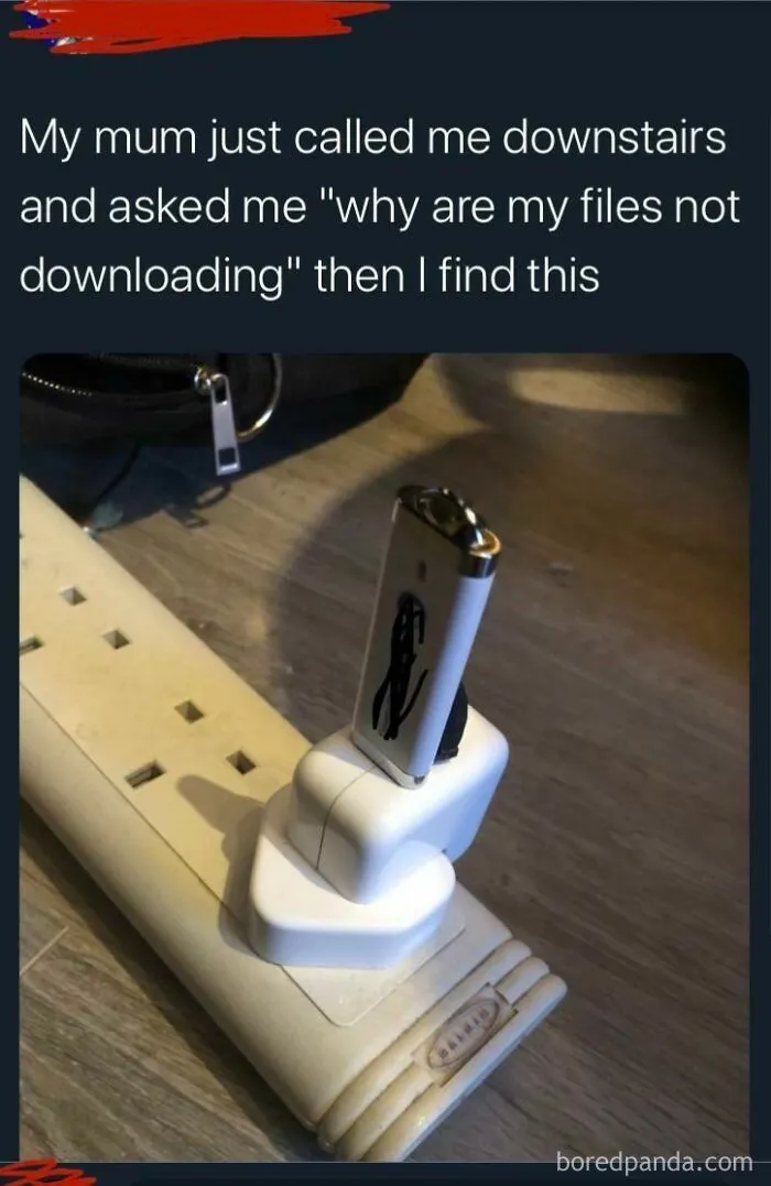 A USB stick plugged into a wall socket instead of a computer, demonstrating a dumb person's mistake.