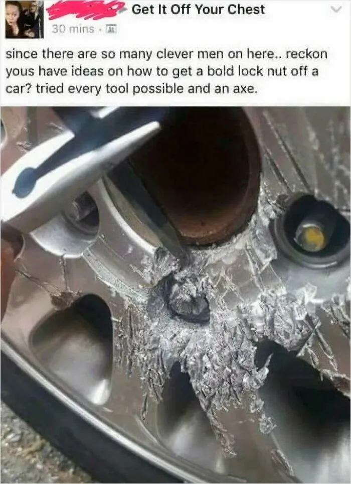 A severely damaged car wheel, illustrating dumb attempts to remove a lock nut with an axe, causing significant damage.