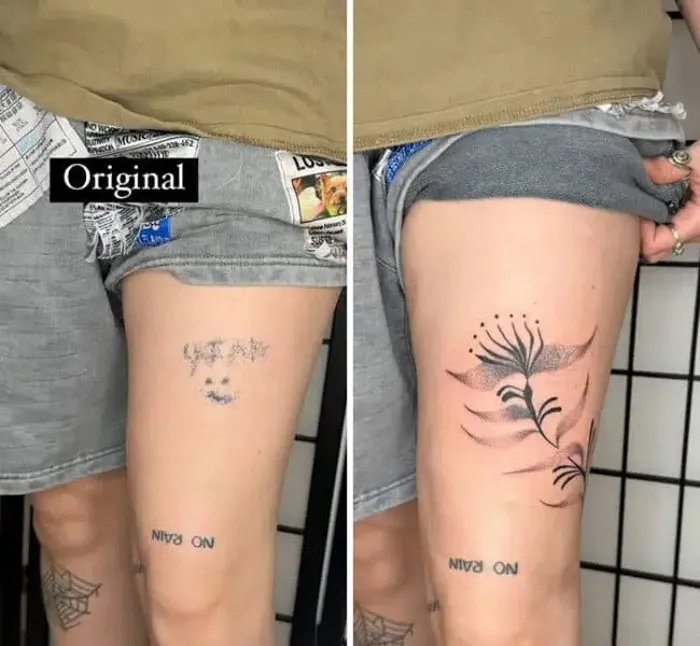 Leg tattoo cover-up: an old faded design transformed into a detailed botanical illustration with flowers.