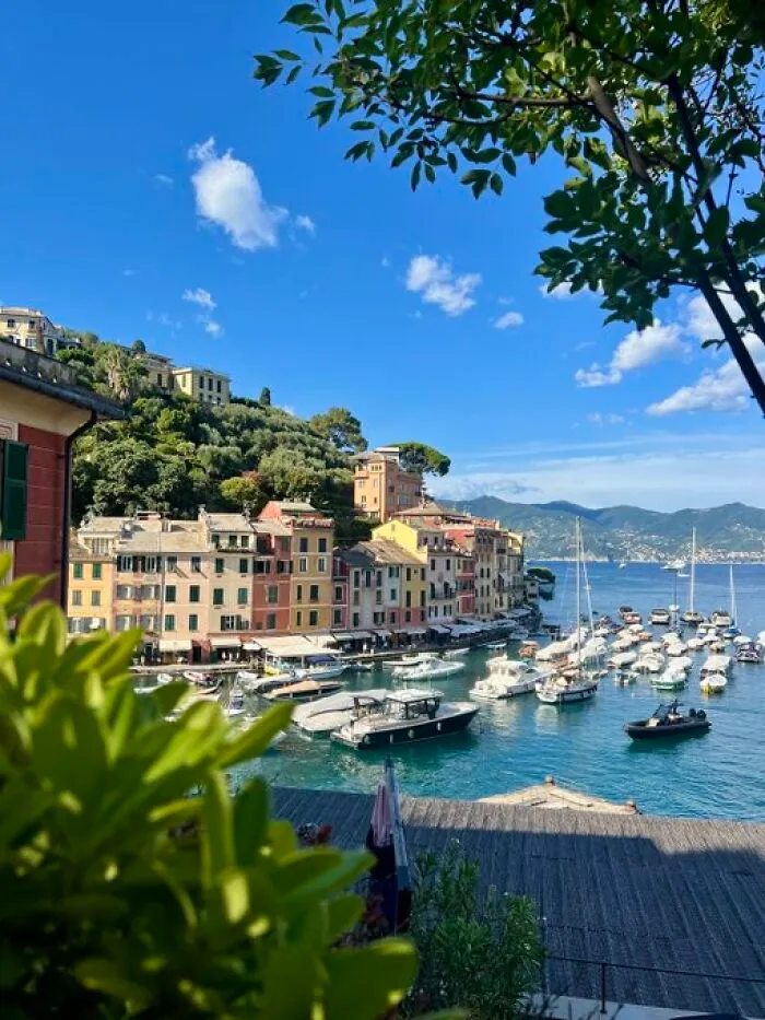A charming coastal town with colorful buildings and boats in a harbor, showcasing buildings with character.
