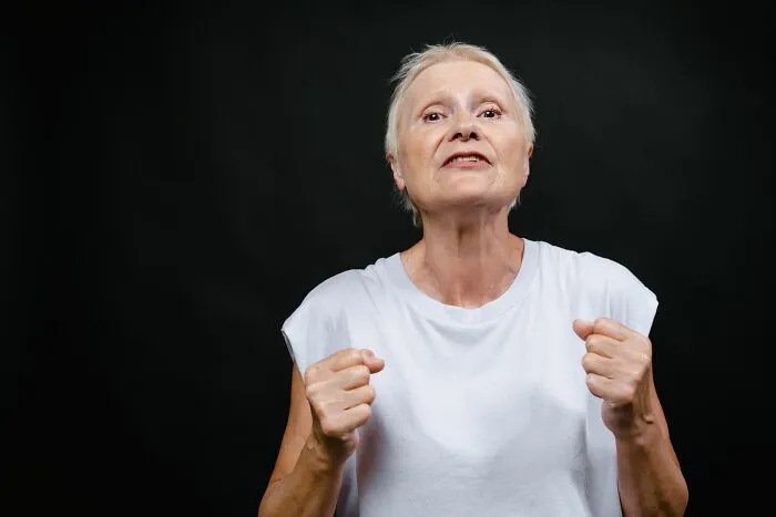 An elderly woman with a determined expression, symbolizing patients who said weird things.