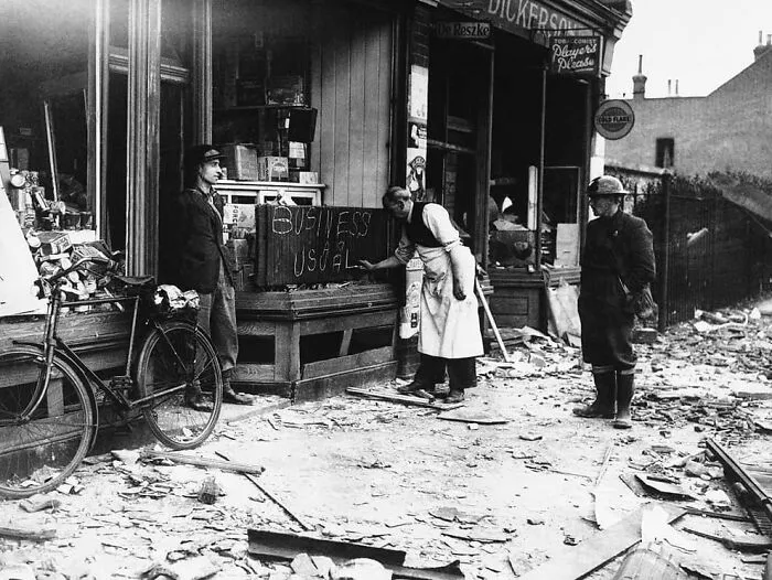 "Business As Usual" Undaunted By A Night Of German Air Raids In Which His Store Front Was Blasted, A Shopkeeper Opens Up The Morning After For “Business As Usual” In London