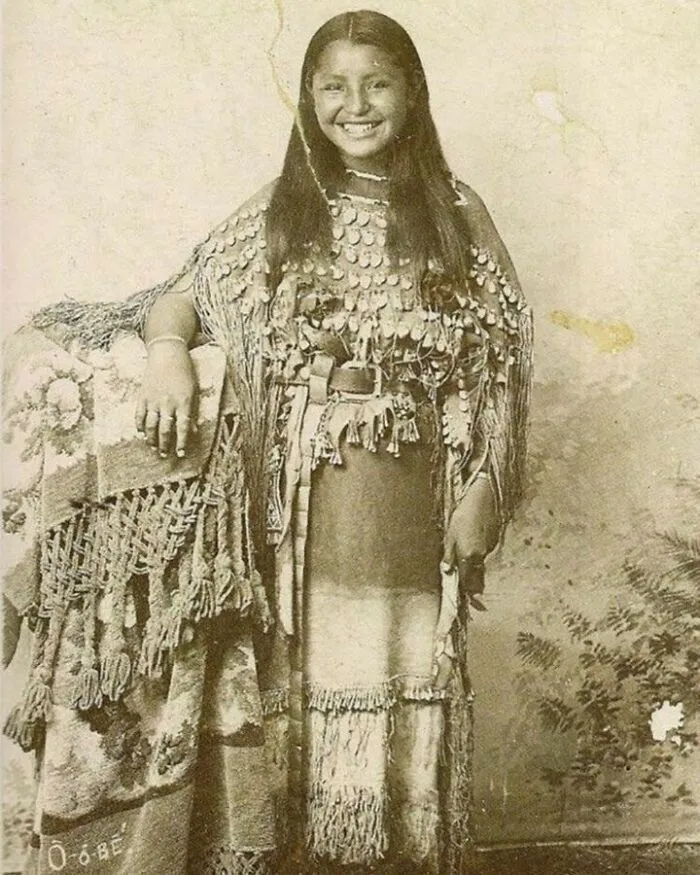 This Rare 1894 Photograph Shows A Young Indigenous Woman Smiling At The Viewer