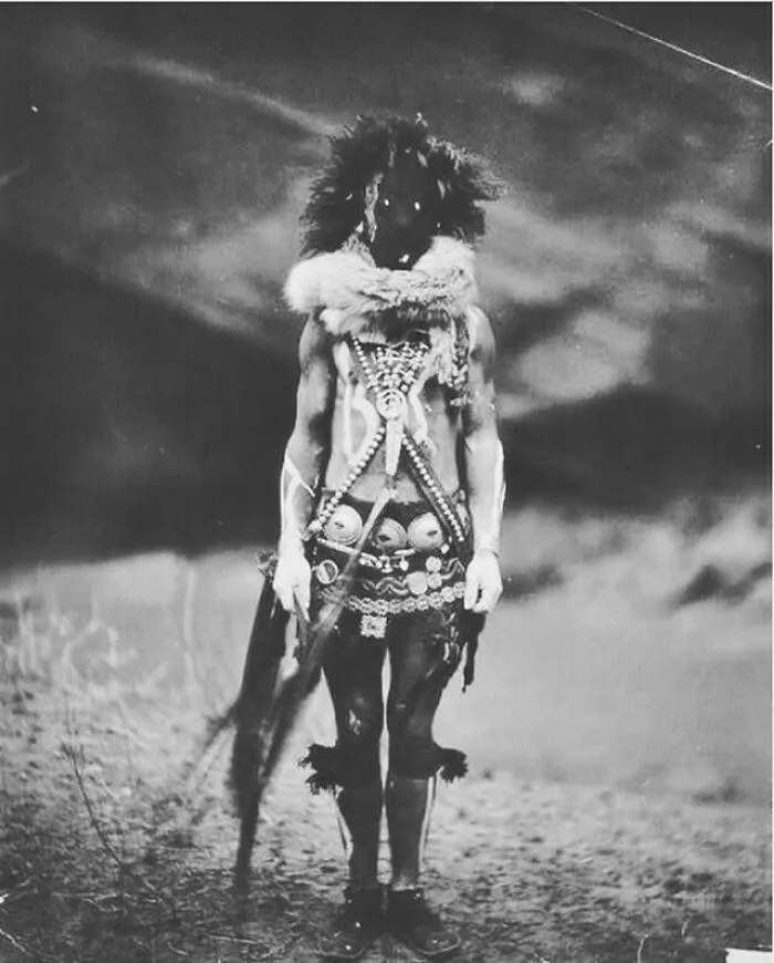 A Navajo Man Wearing A Ceremonial Mask And Dress Of Nayenezgani, 1904