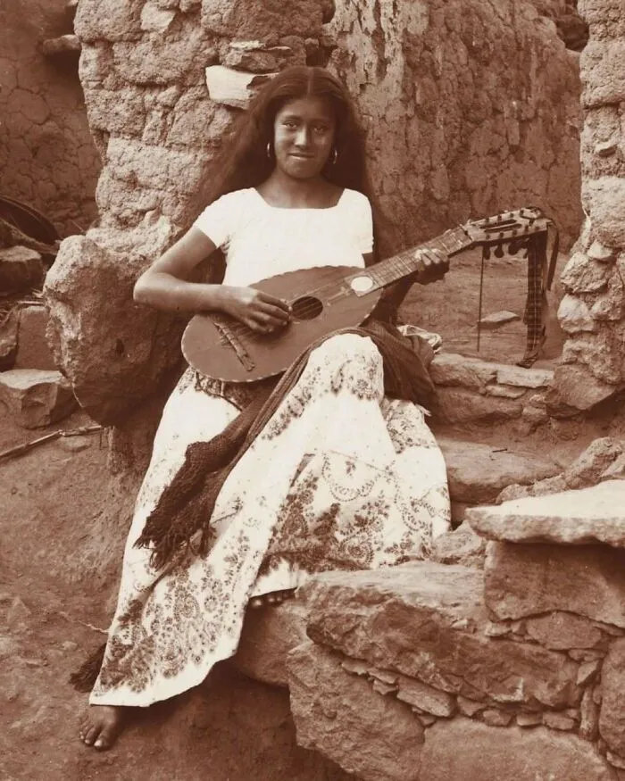 Young Woman From Guanajuato, Mexico Playing A Mandolina Conchera, A Guitar-Like Instrument Traditionally Made From The Shell Of An Armadillo Circa 1895