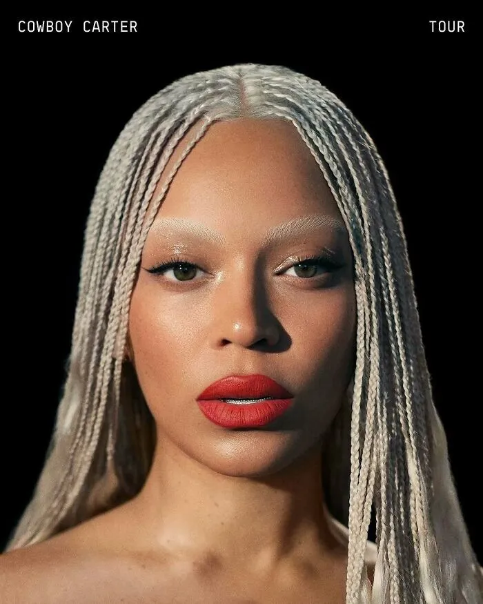 Close-up of a woman with braided white hair and red lipstick, representing amazing world records.