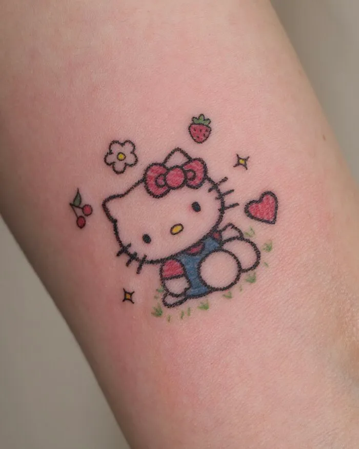 Cute Hello Kitty tattoo resembling a childhood crayon drawing, highlighting artistic and unfiltered creativity.