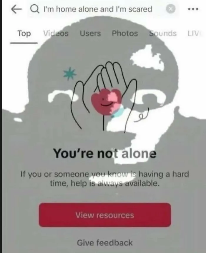 An internet search for I'm home alone and I'm scared, showing a mental health message You're not alone, an unhinged meme.