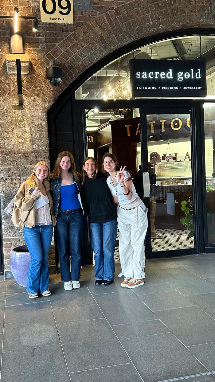 Three Tourists Taking Home A  Permanent Souvenir From London