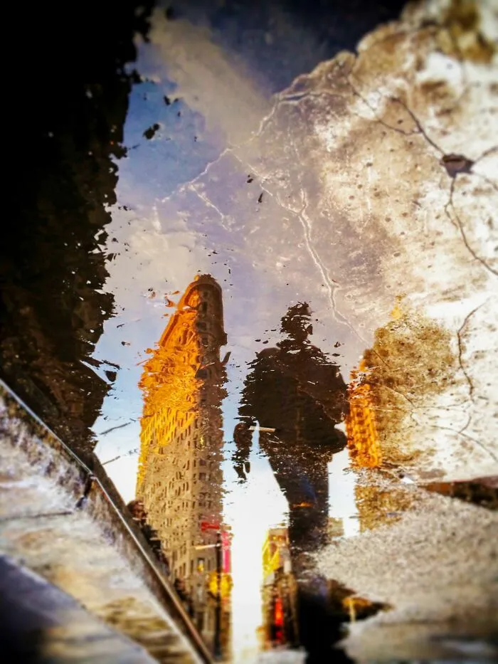 “Puddle Scape: Flatiron Crossing” By Pierre Hauser