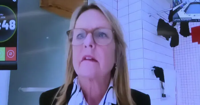 Politician Caught In Awkward Scandal After Constituents Notice Her Background In Livestreamed Meeting