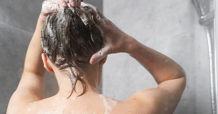 Woman Sparks Wild Theories After Claiming She Gets Odd "Pulling Sensations" In Scalp Only After Showering At Home