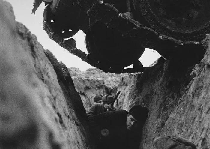 The First Is A Tank Rolling Over Entrenched Russian Infantry