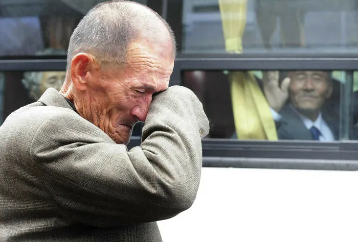 North Korean Man Saying Goodbye To His South Korean Brother