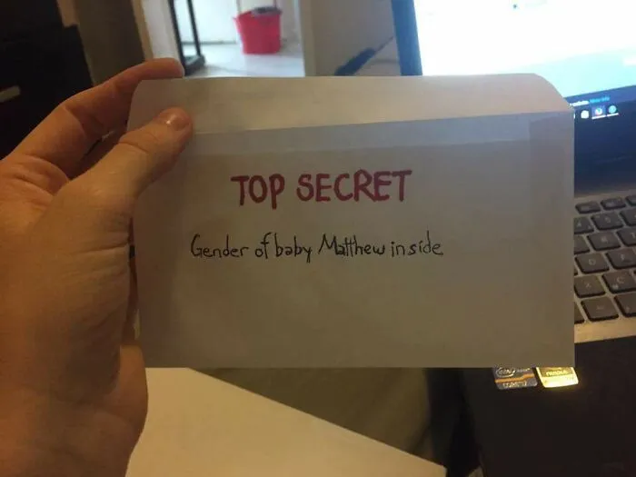 A white envelope with TOP SECRET and Gender of baby Matthew inside written on it, highlighting a dumb moment.