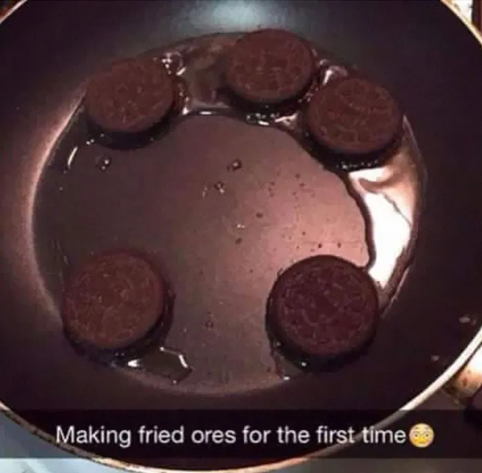 A dumb person making fried Oreos in a pan filled with oil for the first time.