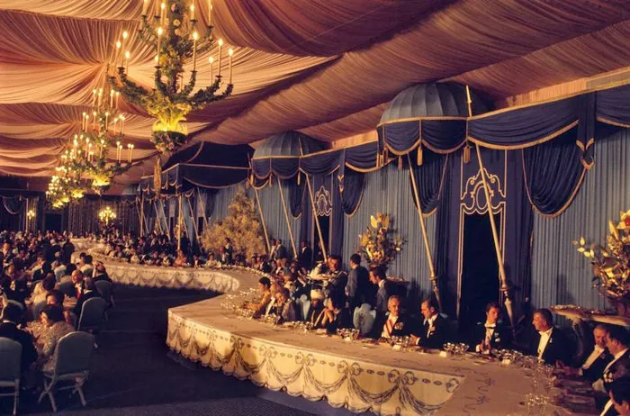 A lavish banquet hall with many guests, a historical event showcasing amazing world records.