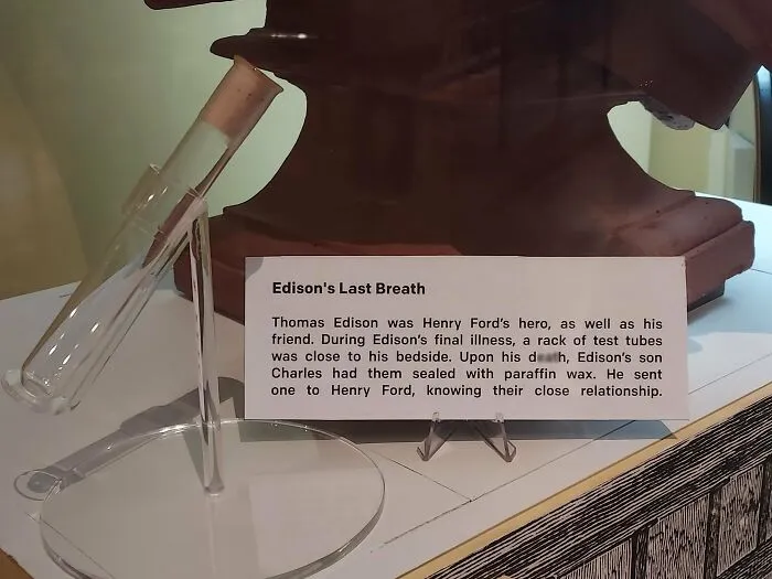 A test tube display with a plaque about Edison's Last Breath, a fascinating photo from American history.