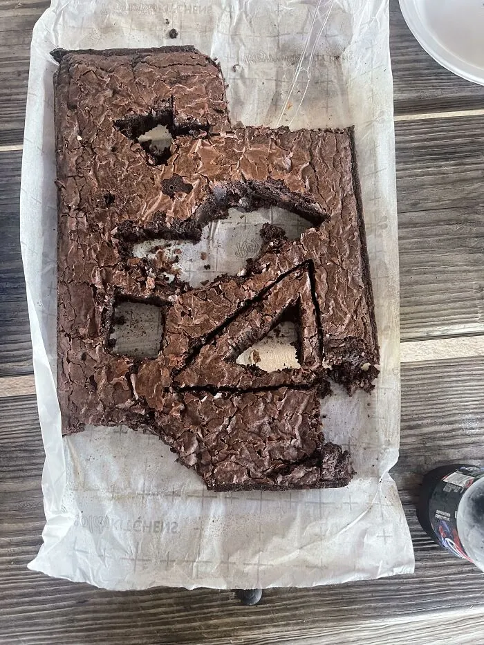 Chocolate brownie with geometric shapes cut out of it, showing odd food combinations.