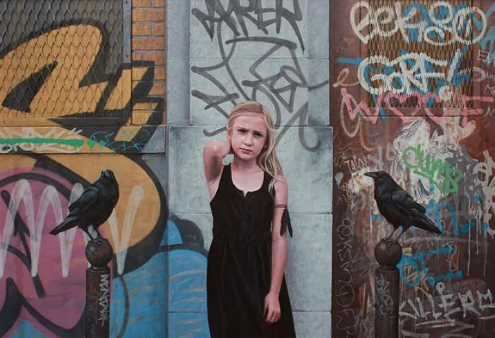 A young girl and black ravens in dystopian paintings by Kevin Peterson showcasing a ruined urban background