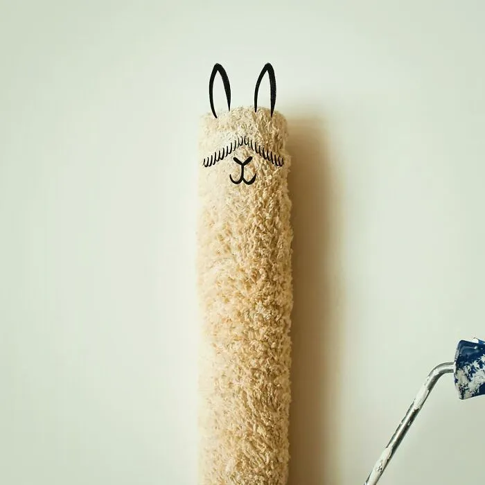 An illustration of a paint roller transformed into a llama, demonstrating everyday objects coming to life.
