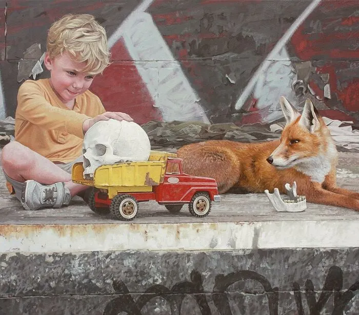 A young boy playing with a toy truck and a skull next to a red fox in dystopian paintings by Kevin Peterson.