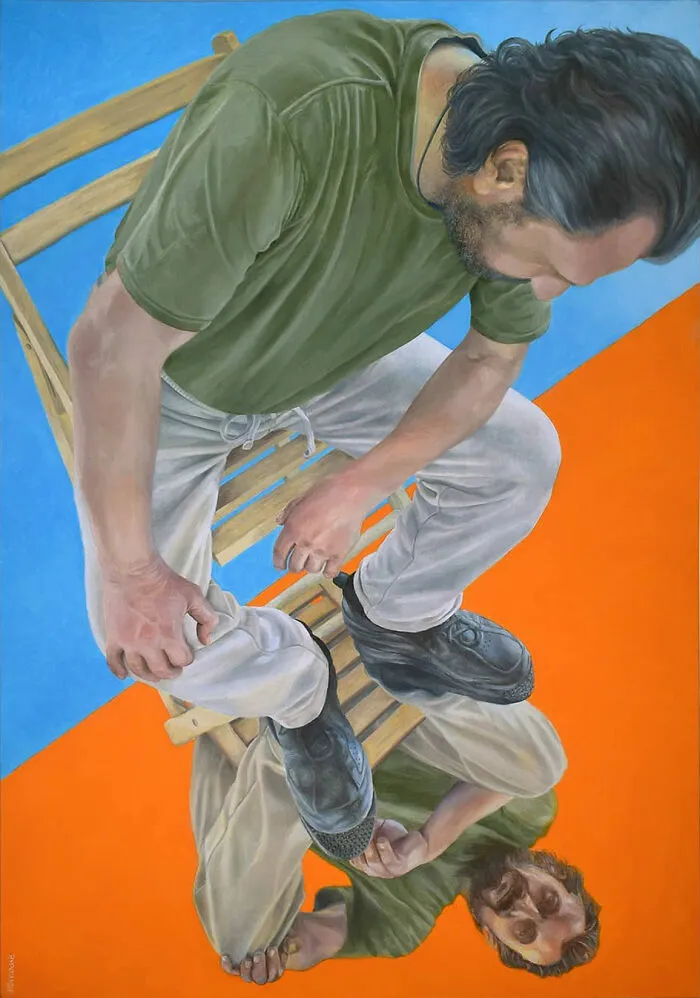 Man on chair in a Michel Devanakis artwork using extreme perspective to view the human form.