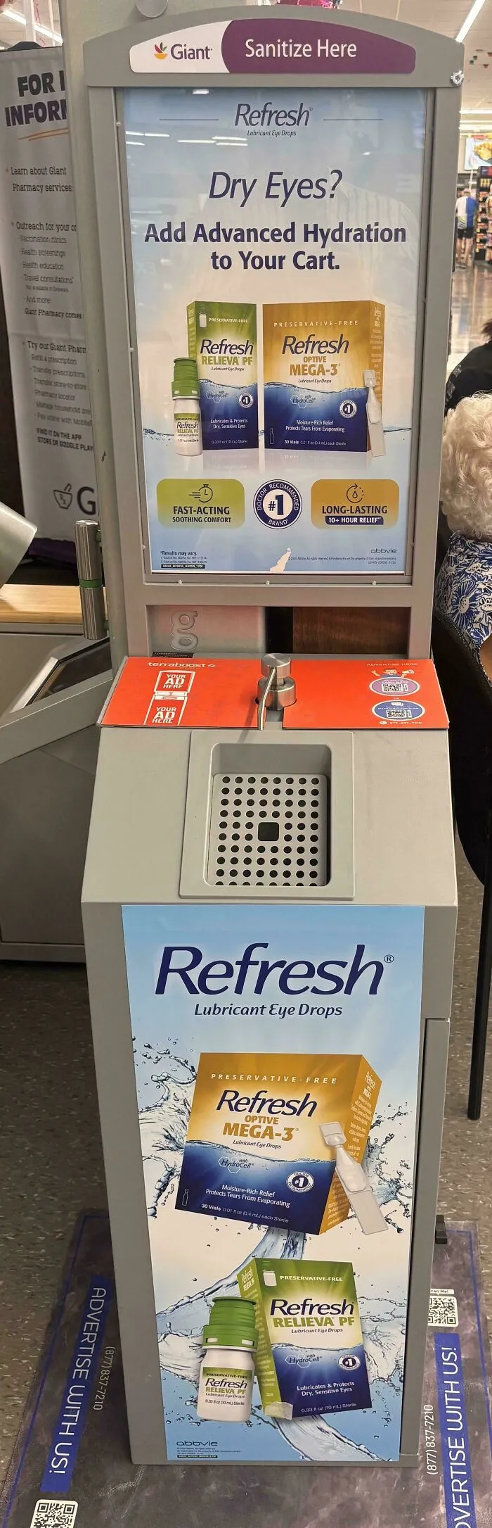 An ironic ad placement for eye drops on a hand sanitizer station in a store, highlighting the importance of context.