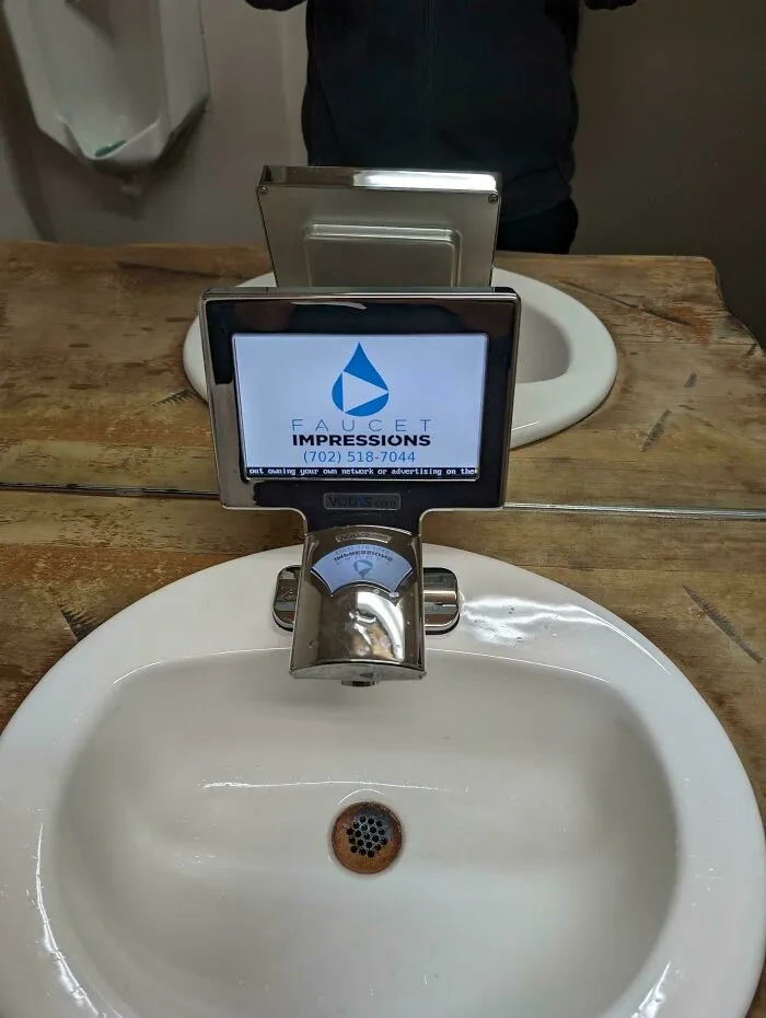 This Restaurant's Bathroom Faucet Has A Display For Ads
