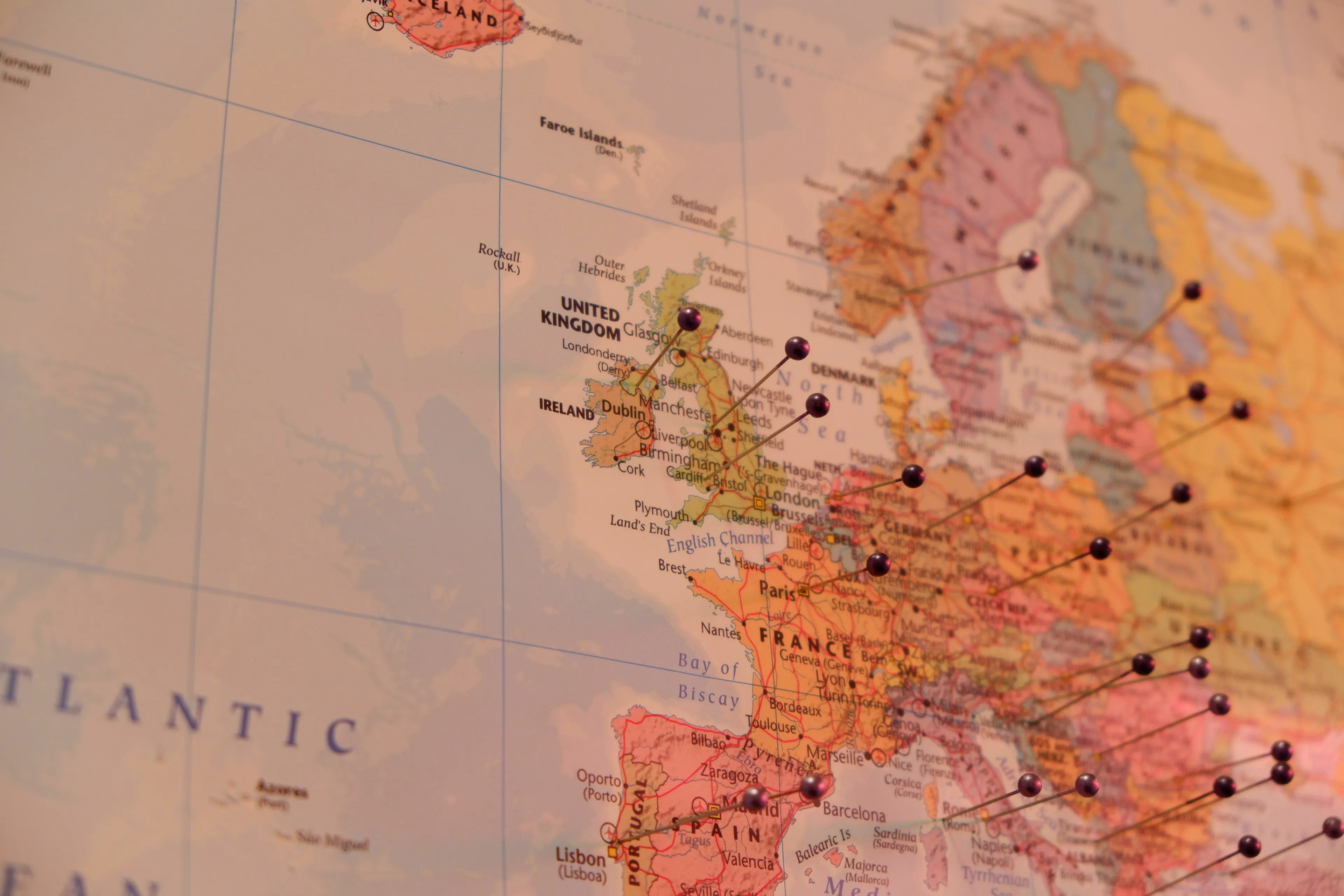 Close-up of a map of Europe with pins, part of a General Knowledge Quiz about a country.