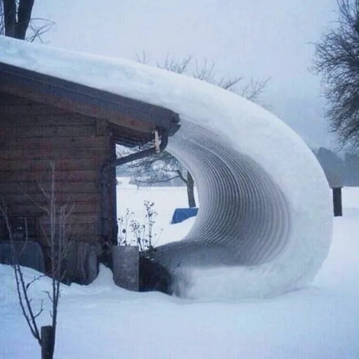 The Way The Snow Curls Off This Roof