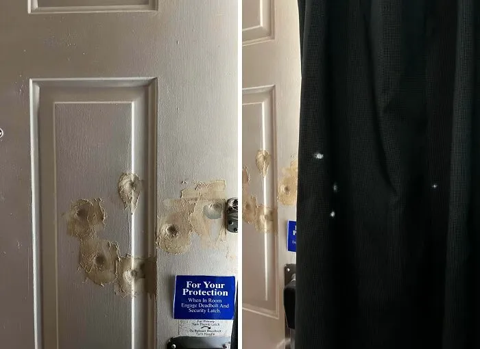 A truly bizarre white door with multiple bullet holes and repairs, and a dark curtain with light spots.
