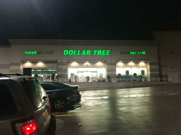 The Dollar Tree store sign at night, the green letters glowing and perfectly synced with the lighting below.