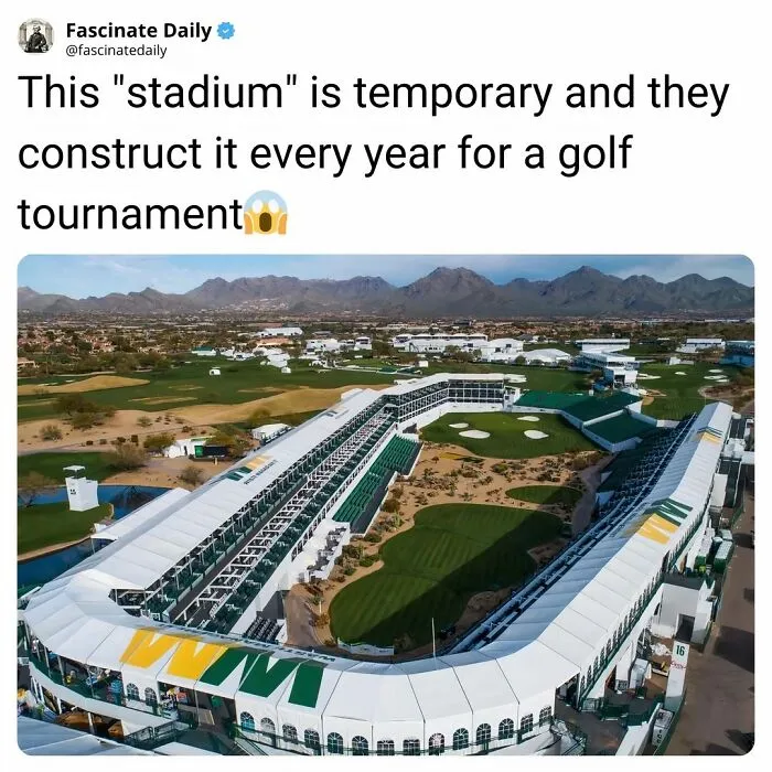 Temporary stadium constructed annually for a golf tournament with mountainous backdrop