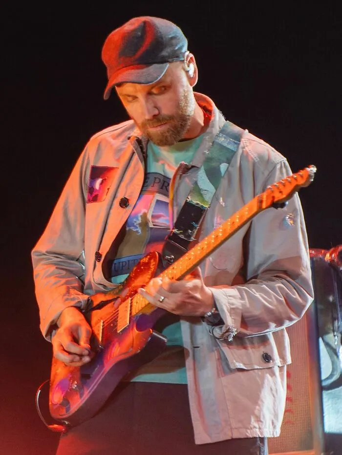 Guitarist Jonny Buckland, 49