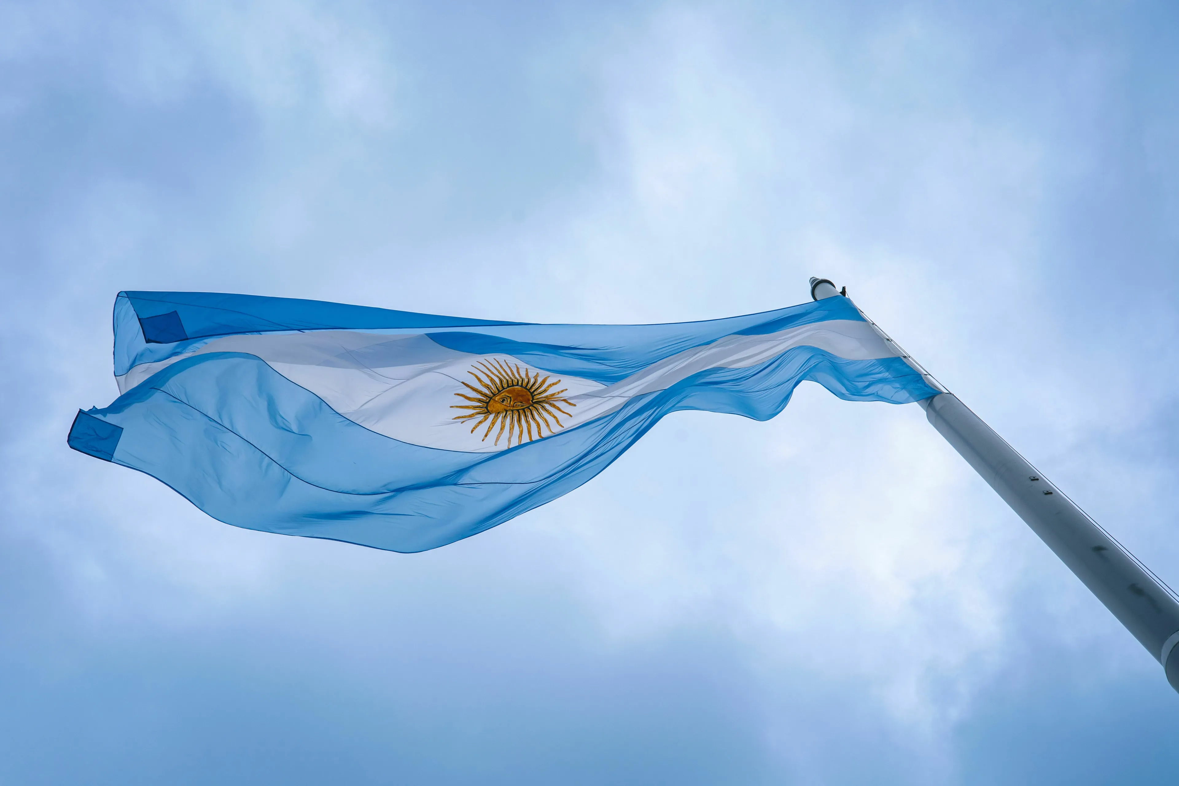 Argentina flag waving in the sky, for a general geography knowledge quiz about the capital of Argentina.