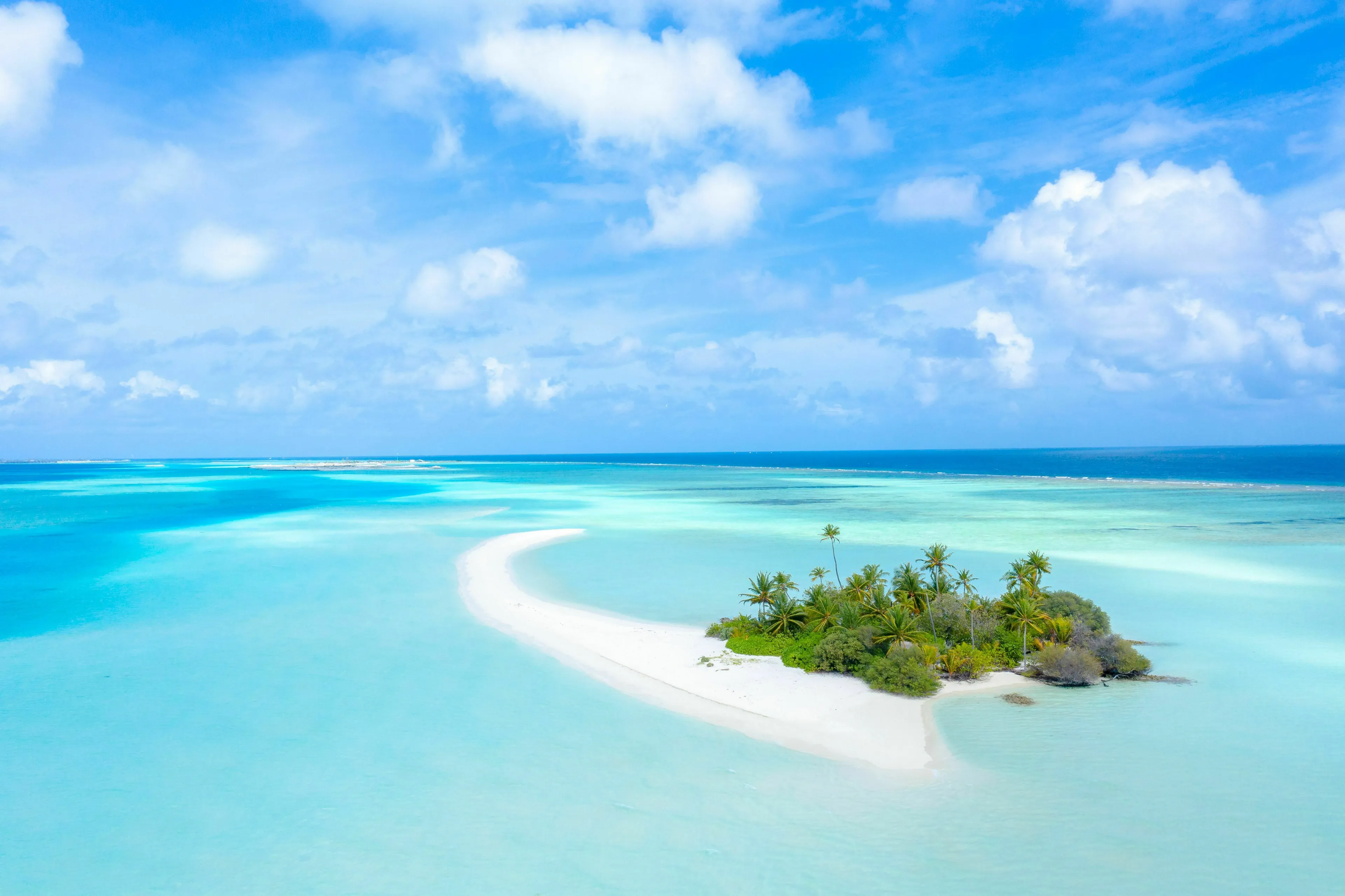 General Geography Knowledge Quiz: A small, lush island with a white sand beach surrounded by turquoise ocean, largest island.