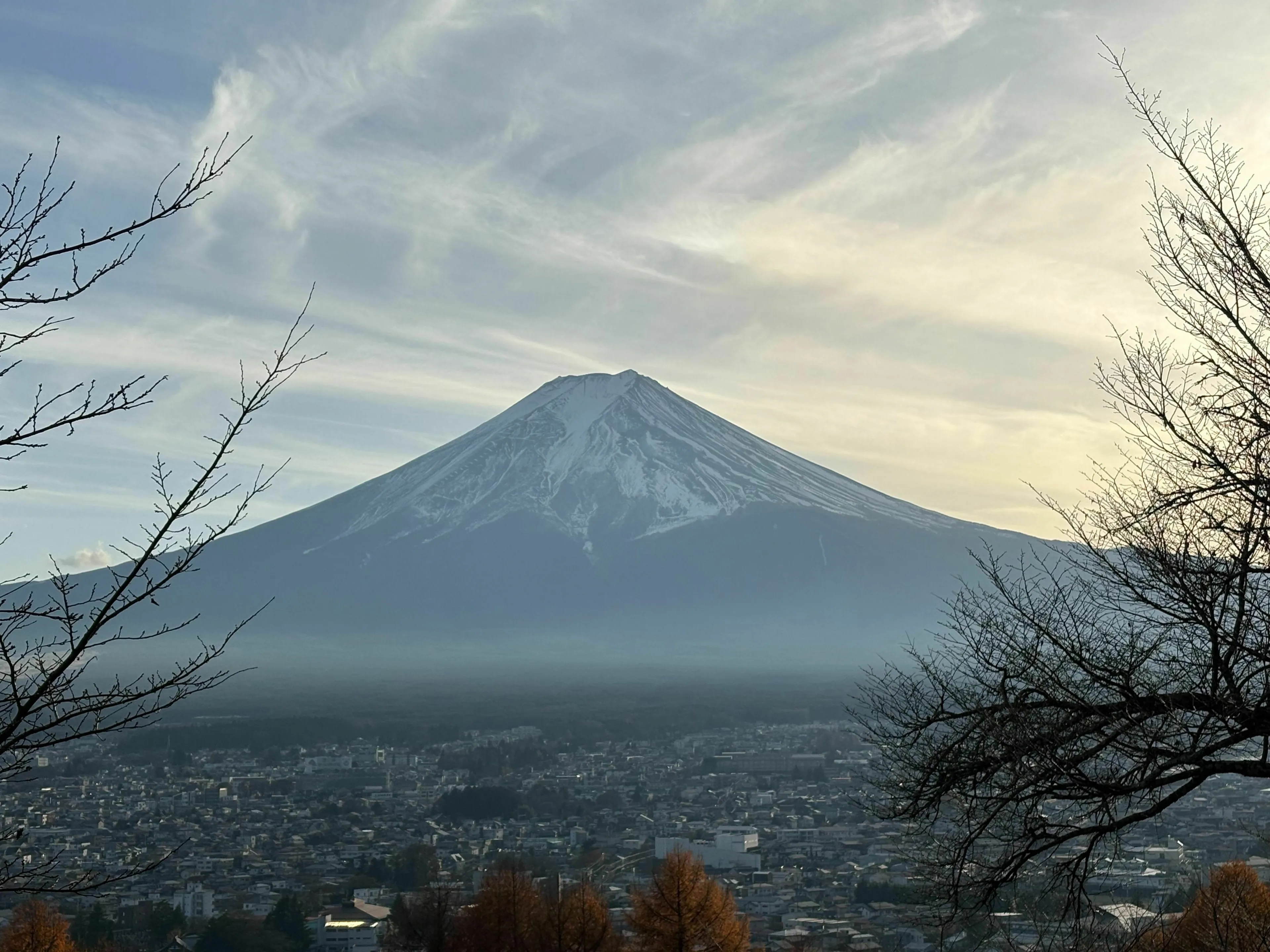 General Geography Knowledge Quiz: A majestic Mount Fuji with a snow-capped peak, towering over a city in Japan.