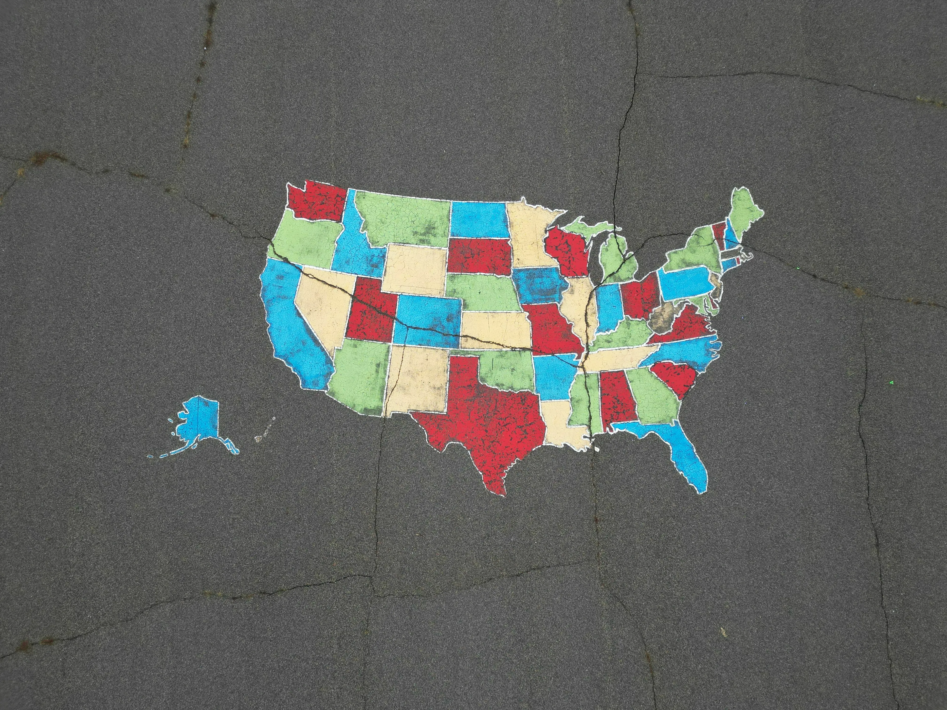 Colorful map of the U.S. states, with Alaska included, highlighting the largest by area in a geography quiz.