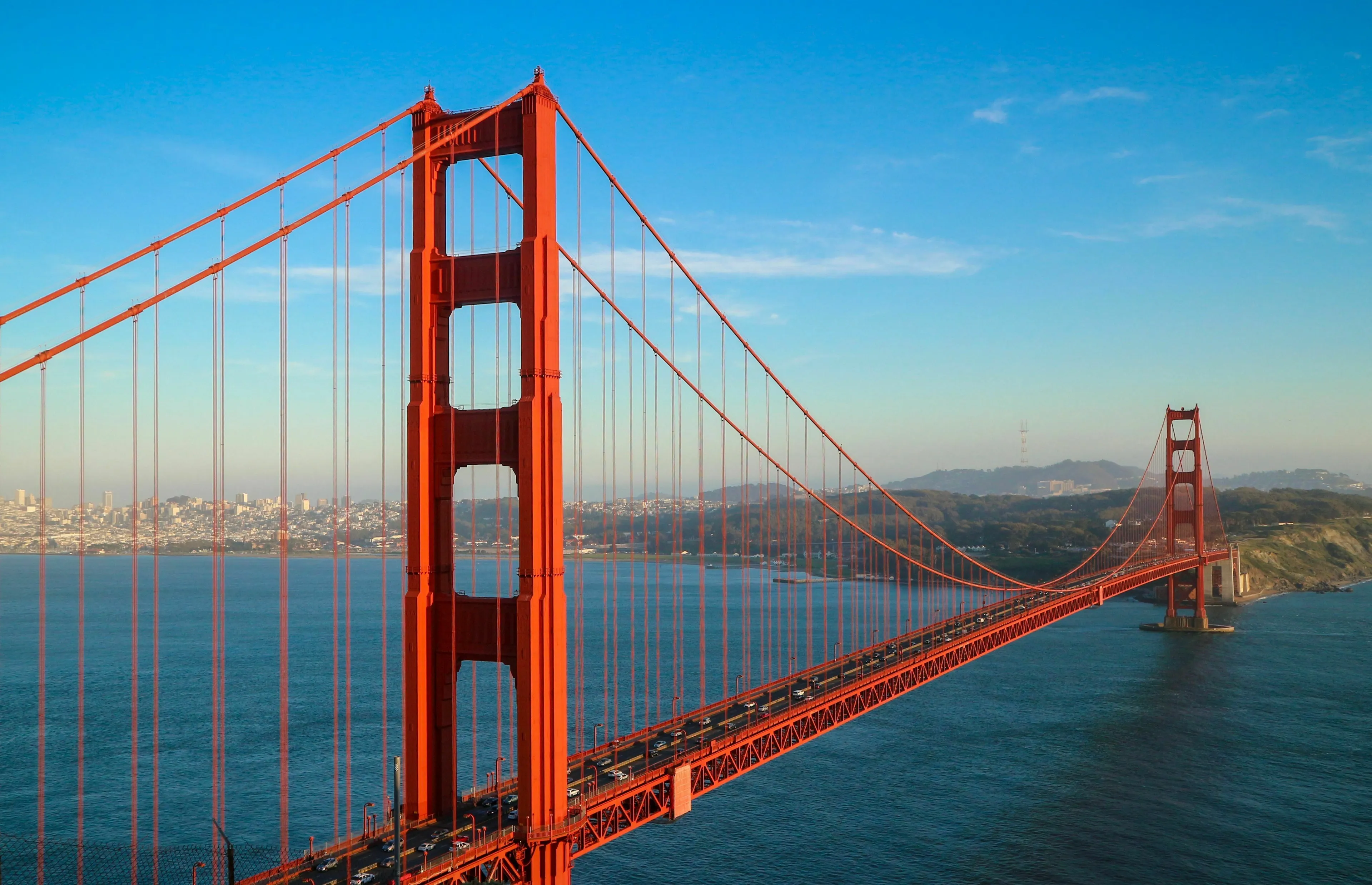 Golden Gate Bridge spanning a body of water with a city in the background. General Geography Knowledge Quiz.