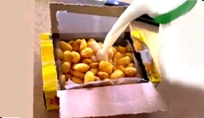 Pouring milk into a nostalgic cereal box representing childhood tastes for Gen X